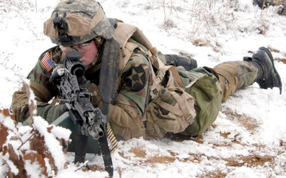 A Manchu machine gunner takes up a defensive position in the snow at Rodriguez Range on Thursday.