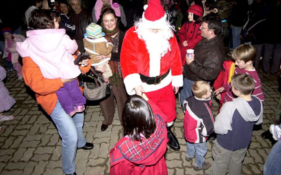 Santa visits with residents Thursday during the “Holiday Tree Lighting Ceremony” at Osan Air Base, South Korea.