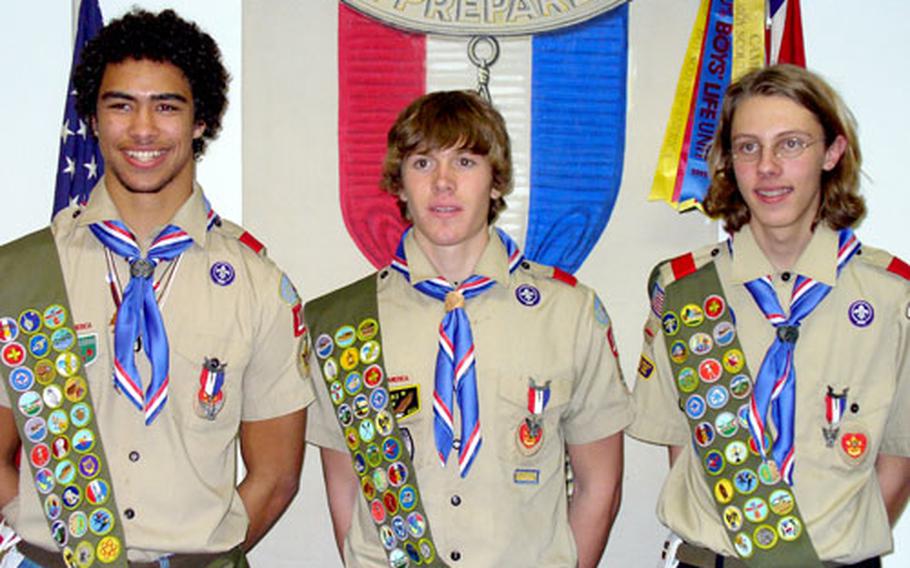 From left, Chad Abramson, John Christensen and Kevin Stone received Eagle Scout awards Thursday at the Hainerberg Chapel in Wiesbaden, Germany.