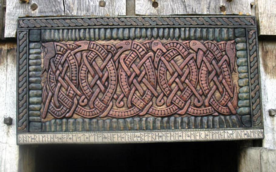 A re-created Anglo-Saxon piece of art sits above the door of one of the buildings at the West Stow Anglo-Saxon Village and County Park.
