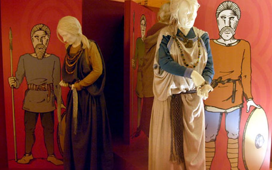 Mannequins are made up in what is believed to be traditional Anglo-Saxon clothing.