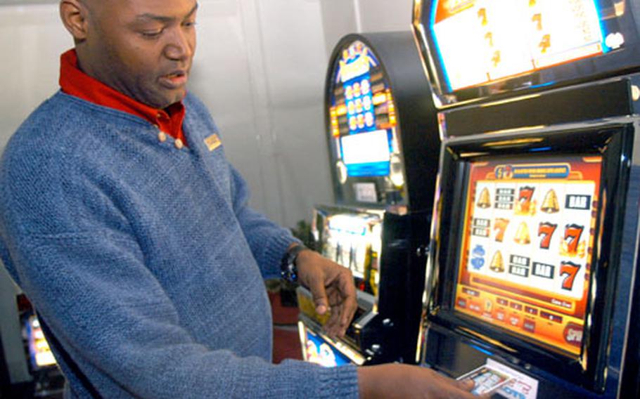No more counting quarters or coin-dusty fingers for Jon Remmer, MWR Recreation Center manager at Naval Air Facility Atsugi in Japan. He demonstrated how to use the 28 new coinless slot machines Tuesday at the Corner Pocket.