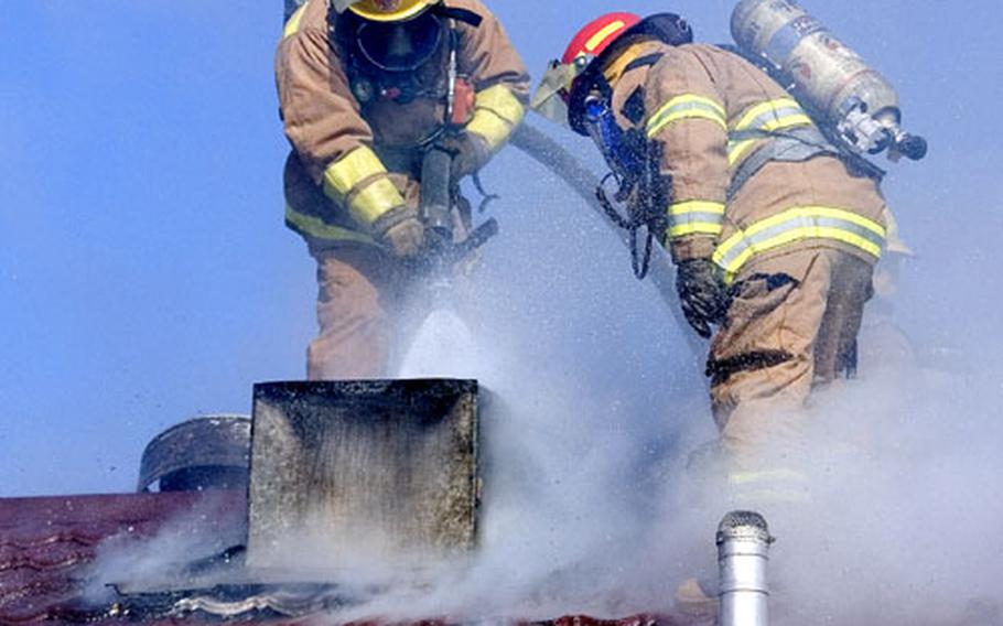 Yongsan Fire Department personnel respond to a fire in a vacant housing unit on Yongsan Garrison, South Korea, on Thursday. No injuries were reported; firefighters battled the blaze for about an hour.