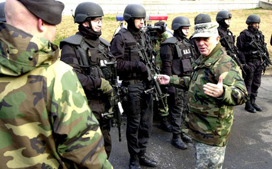 U.S. Forces Korea commander Gen. Leon J. LaPorte chats with members of an 8th Military Police Brigade Special Reaction Team during a visit Friday morning.