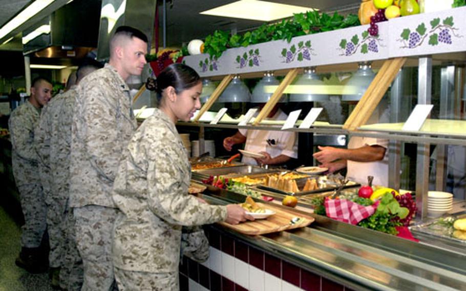 Marines move down the serving line as they get lunch at Mess Hall 488 on Camp Foster, Okinawa. The facility recently was named the Best Jointly Operated Garrison Mess Hall in the Marine Corps.