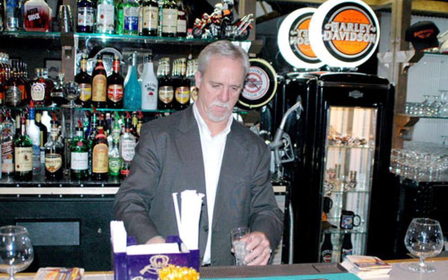 Kevin Dugan, manager of Sasebo Naval Base’s Harbor View Club, checks on the equipment behind the bar Thursday at the newly renovated all-ranks club HOG Heaven, set for a grand opening Wednesday at 5 p.m.