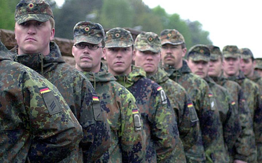 German soldiers stand outside Ramstein Air Base in May 2005.