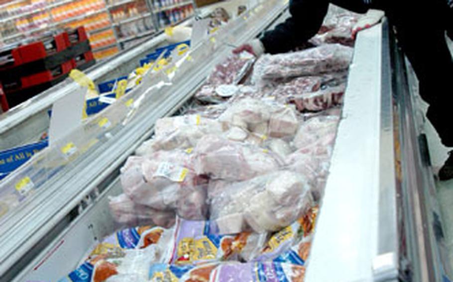 Frozen ox tails, like these being stocked by this commissary worker, are also popular on the black market.