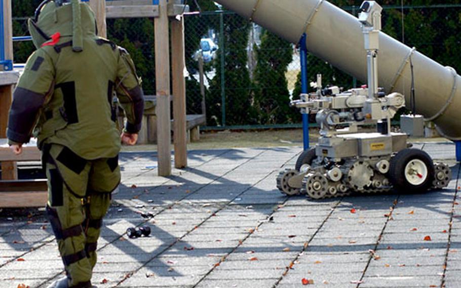 An Explosive Ordnance Disposal Marine repairs an explosive attached to the remote ordnance neutralization system during the Active Shield exercise at Marine Corps Air Station Iwakuni on Thursday.