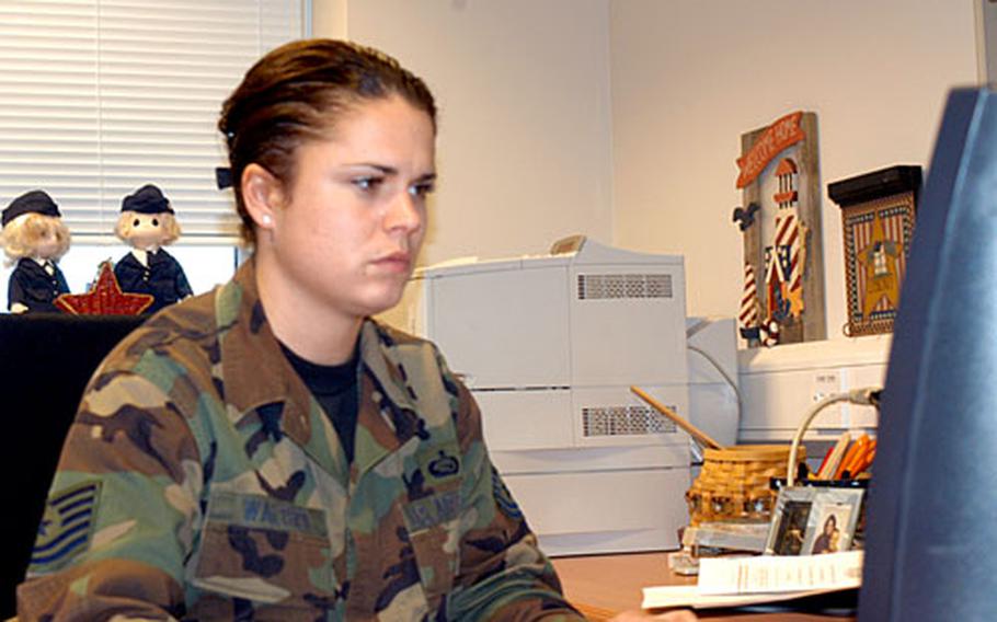 U.S. Air Force reservist Tech Sgt. Lorie Walther works at her office on RAF Lakenheath. The 29-year-old from Pennsylvania is one of 87 Air Force reservists serving in the United Kingdom as part of the Individual Mobilization Augmentee program.