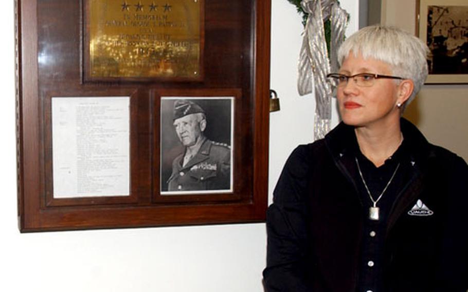 Helen Patton Plusczyk, granddaughter of Gen. George S. Patton Jr., stands next to the display case outside the radiology department at Heidelberg Army Hospital during the Gen. George S. Patton Jr. memorial ceremony Monday.