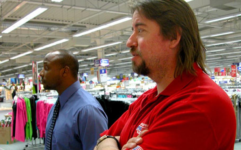 Army and Air Force Exchange Service loss prevention managers Sid Harris, left, and Steve Boyd, are on the lookout for shoplifters at the Würzburg, Germany, exchange.