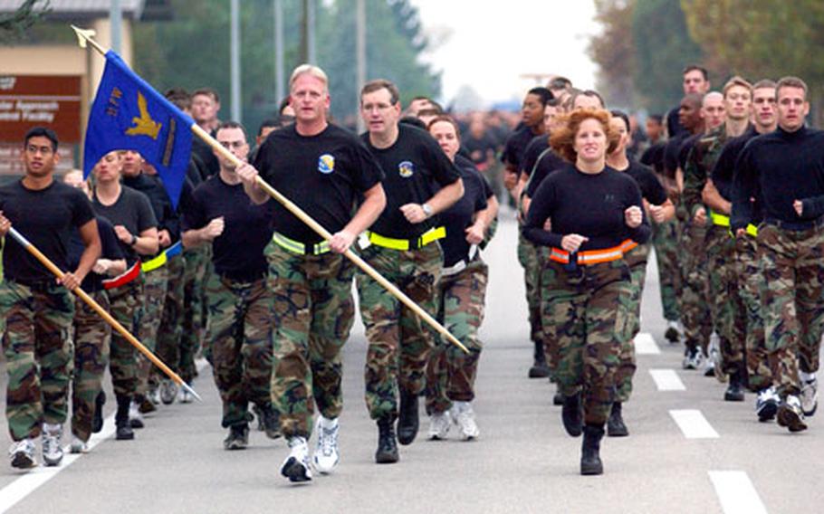 Col. Kimberly Toney, 31st Mission Support Group commander, leads the 31st Communications Squadron during a combat fitness run at Aviano Air Base, Italy, in November.
