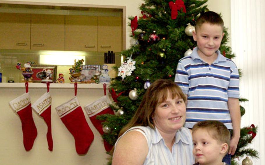 Brigitte Appelman gets ready for Christmas with her sons, Hartley and Ashton. She is expecting to give birth to her third child any day now. Her husband deployed to Iraq earlier this month.