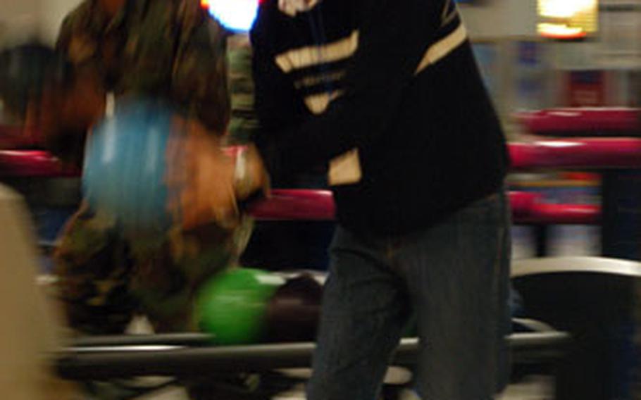 A South Korean university student prepares to pick up a spare during a visit to Kunsan Air Base as a guest of the base’s 8th Fighter Wing in South Korea.