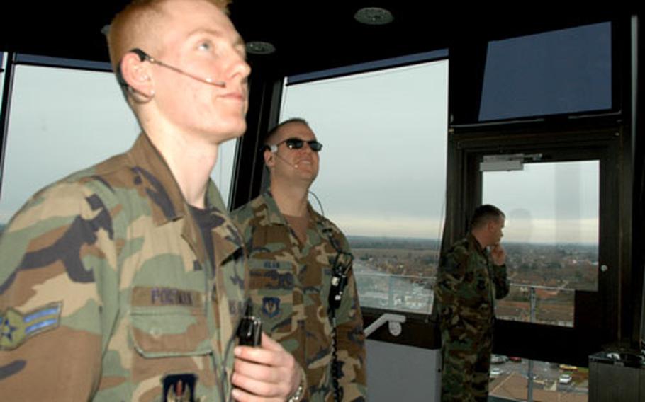 During Vice President Cheney’s layover, Airman 1st Class Beau Portman, foreground, and Tech. Sgt. Jason Milam watch the radar in the RAF Mildenhall air traffic control tower.