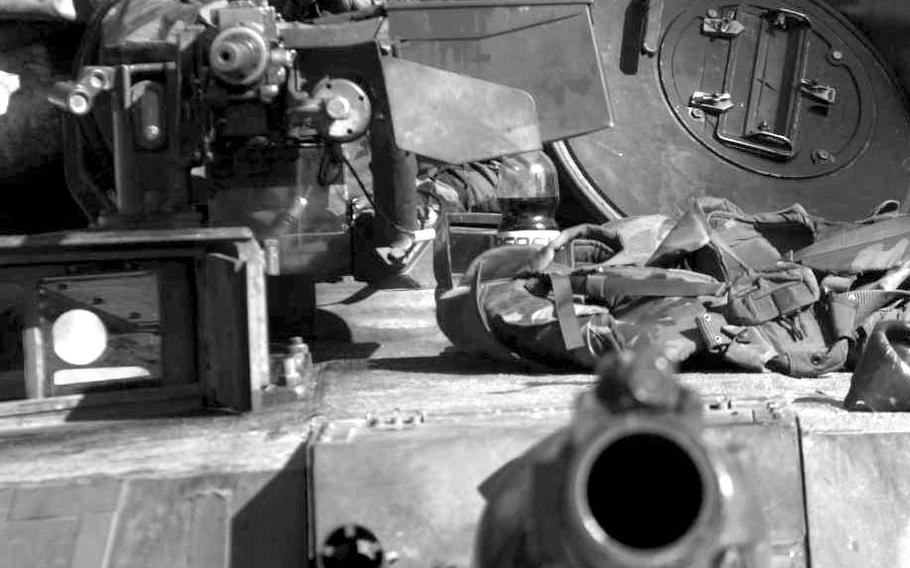 February, 1996: Pvt. Reggle Ficklin of Company C, 2nd Battalion, 68th Armored Regiment out of Baumholder, Germany, mans the turret of a M1A1 Abrams tank at Checkpoint 52 south of Olovo on IFOR route Python.