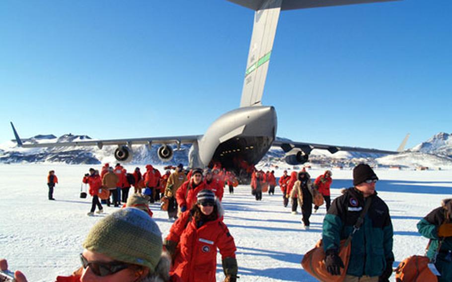 U.S. Antarctic Program participants arrive by C-17 at the sea ice runway at McMurdo Station.
