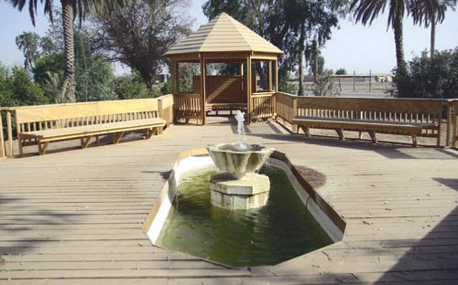 Soldiers from the 2nd Brigade Combat Team built this memorial for their fallen comrades at FOB Ramadi, Iraq. Some 70 names, engraved onto metal plates, adorn a board under the gazebo. The fountain is kept running 24 hours a day.