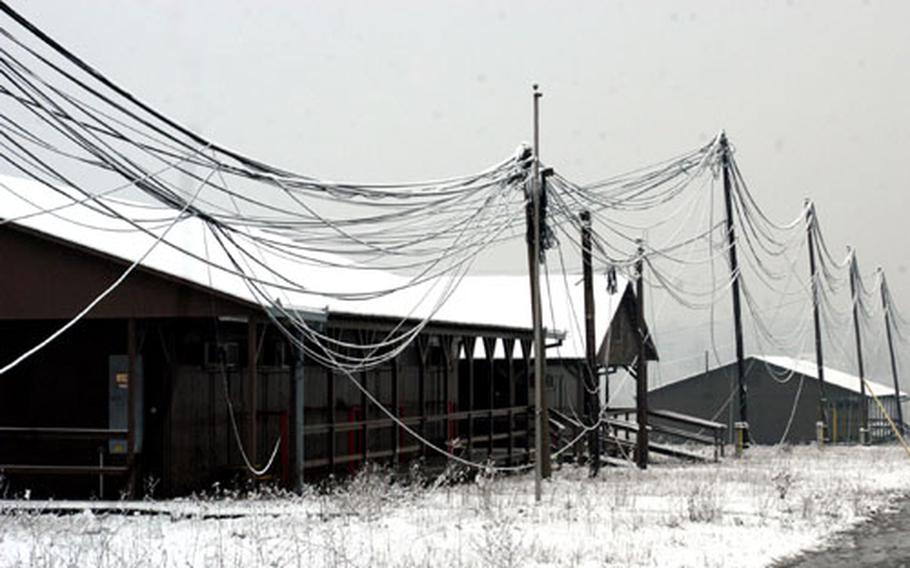 Eighteen Bosnian army soldiers guard the former U.S. base known as Camp Comanche. Bosnian officials are expected to close scores of military facilities in 2006, though the fate of this abandoned camp, adjacent to Tuzla Air Base, has yet to be decided.