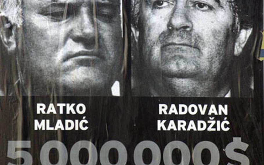 Two of Bosnia's most notorious war criminals remain at large, as this 2002 poster suggests. Bosnian Serb Gen. Ratko Mladic and Bosnian Serb leader Radovan Karadzic both face war crime trials.