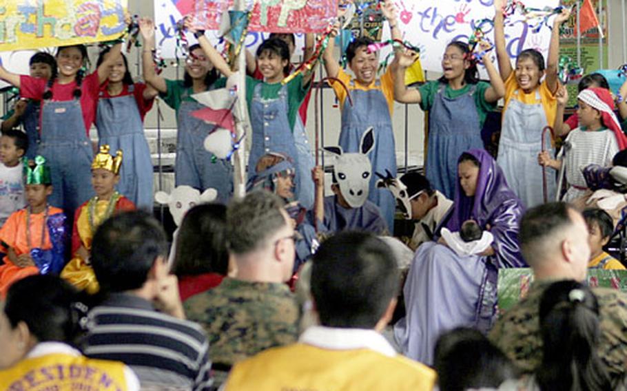 U.S. Marine Corps Children from Calvary Chapel Bacolod Orphanage perform a Christmas play in Bacolod, Philippines, on Dec. 28 for Marines and sailors from Okinawa, Japan. The orphanage was among 14 nonprofit organizations in the Philippines that received Christmas gifts and clothes from servicemembers from III Marine Expeditionary Force Headquarters Group and their families on Okinawa.