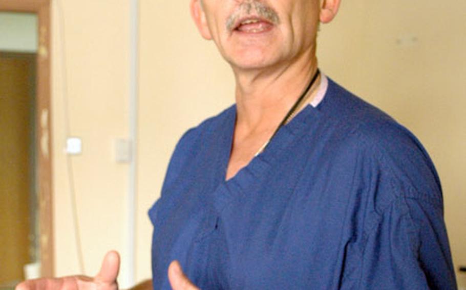 Dr. (Lt. Col.) Mike Gehrke of the 10th Combat Support Hospital in Baghdad discusses the merits of swift pain treatment.