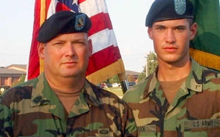 Command Sgt. Maj. Freddie Brock, left, stands with his son, Pvt. Tommy Brock, at Fort Leonard Wood, Mo., in October, where both were stationed. The two are now stationed in South Korea, the father at Yongsan Garrison and the son at Camp Humphreys.