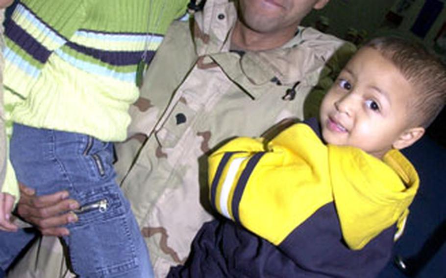 Spc. Romualdo Portes, 29, of Charleston, S.C., was happy to see his daughter Alyssa, 6, and son Alexander, 3, as he arrived in Vilseck, Germany, on Saturday.
