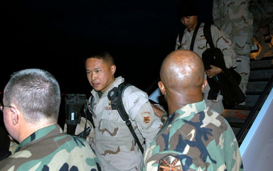 At right with his back to the camera, Command Sgt. Maj. Samuel Wilson, the top enlisted soldier in U.S. Army Garrison-Vicenza, greets Vicenza-based soldiers.