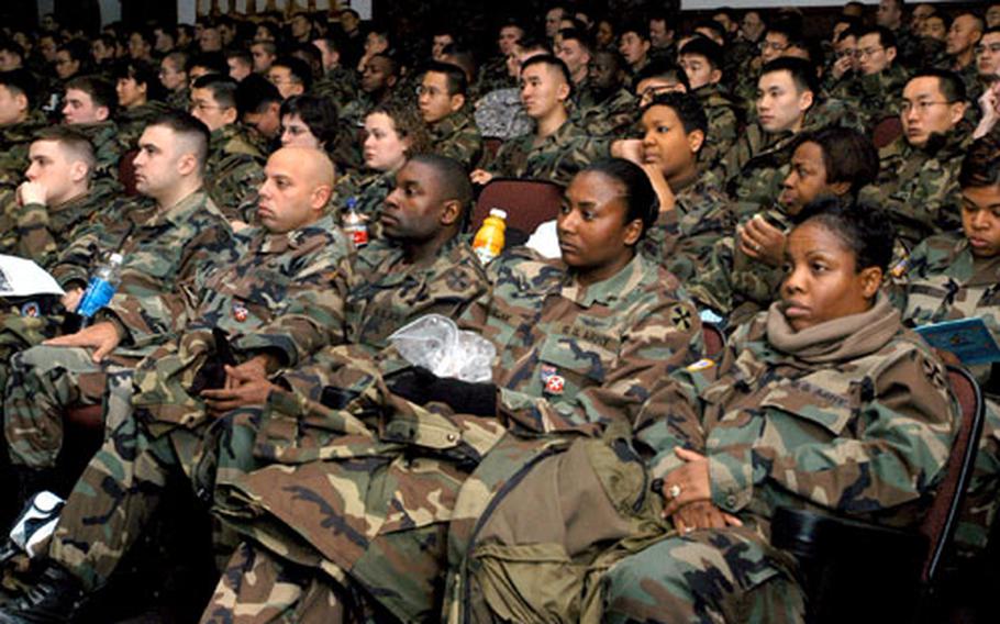 At New Horizons Day, a semiannual training session, members of 8th Army’s Headquarters and Headquarters Company listen to a talk about the Good Neighbor Program, which emphasizes developing friendships between South Koreans and Americans.