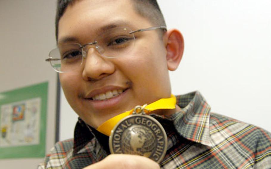 The winner ...A gain. Neil Patrick Villamora held his spot as geography champion of Yokosuka Middle School for the second year running Thursday. Last year, Villamora was the DODDS winner; he went to Washington, D.C. to compete in the national geography bee.