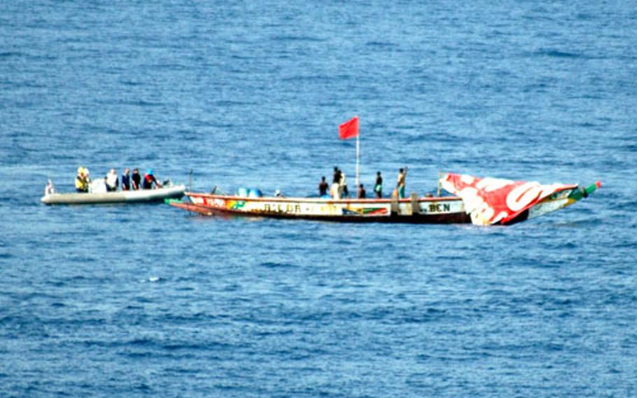 A Rigid Hull Inflatable Boat from the Carr approaches a distressed vessel. The vessel was spotted by lookouts from the 6th Fleet command and control ship USS Mount Whitney.
