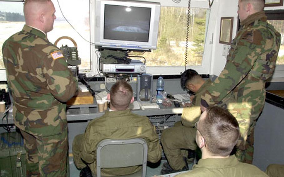 Observer controllers monitor the performance of Troop A, 1st Squadron, 1st Cavalry Regiment Bradley fighting vehicle crews at Grafenwöhr, Germany, on Friday.