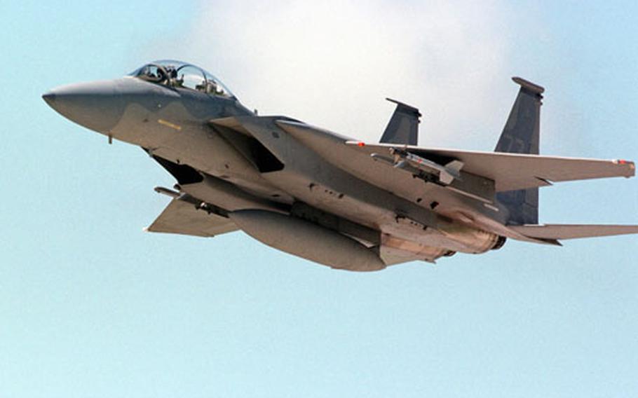 An American F-15 Eagle fighter ascends over Kadena Air Base, Okinawa, in this 1996 photo. An F-15 crashed into the sea Tuesday morning 55 miles off the coast of Okinawa, but the pilot ejected and was rescued with only minor injuries, U.S. military officials said.