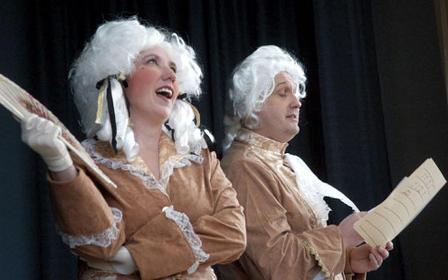 Mozart, aka David Puckett, and his sister Nannerl, played by Tanya Chambers, entertain Argonner Elemetary School students during the school&#39;s Mozart Festival.