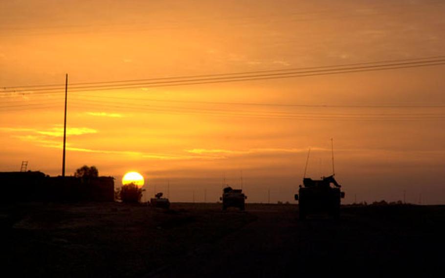 An American Humvee patrol advances down a secondary road south of Tikrit, Iraq, in this undated file photo. To the soldiers, from the 3rd Battalion, 320th Field Artillery Regiment, this road is the epicenter of roadside bomb attacks.