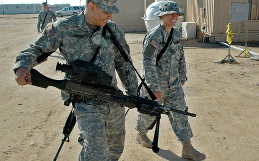 Pfc. Mitchell Brandt and his wife, Spc. Deadre Brandt, both with the 1st Armored Division’s 2nd Brigade, see each other several times a week at Camp Beuhring, Kuwait.