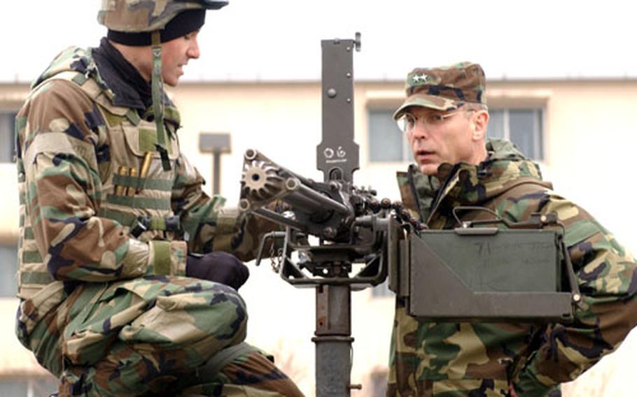 At Kunsan Air Base in South Korea, Air Force Maj. Gen. Mark Anderson, right, gets insight into how Kunsan airmen would defend the base.