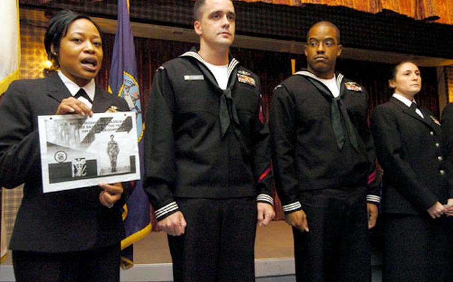Petty Officer 1st Class Latricia Robinson speaks of Petty Officer 1st Class Charity Broomfield, who is deployed and was unable to accept her Sailor of the Year award in person during a ceremony at the Chief Petty Officers Club at Yokosuka Naval Base, Japan, on Thursday.