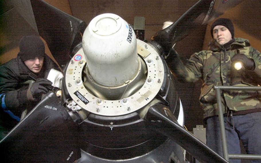Airmen at Ramstein Air Base in Germany work on a C-130 prop engine inside the base’s “Hush House.” The facility allows aircraft mechanics to test engines at any time of the day because the building’s insulation reduces noise to the outside.