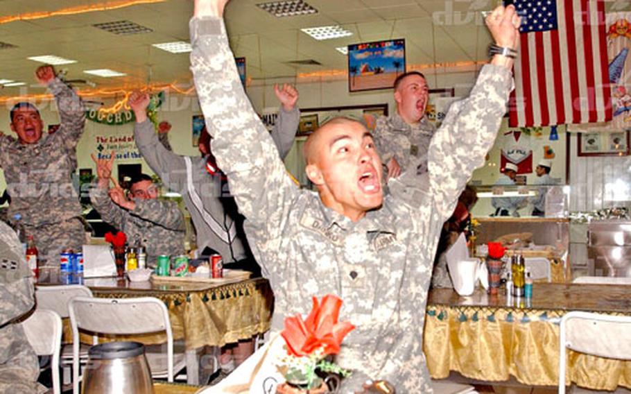As the clock strikes 4 a.m. in Iraq, Spc. John Danko cheers on the Pittsburgh Steelers during their 21-10 victory in Super Bowl XL in Detroit. Danko, a native of Uniontown, Pa., is a member of the 4th Infantry Division’s Headquarters and Headquarters Company, Special Troops Battalion.