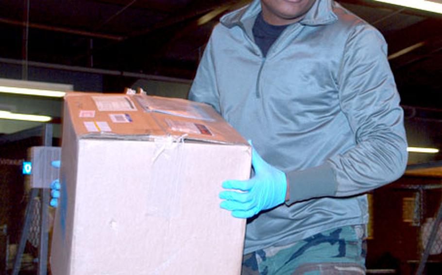 Staff Sgt. Everton Hixson, 24, sorts packages at the RAF Alconbury Area Mail Terminal, which is responsible for all the mail for U.S. military personnel in the United Kingdom.