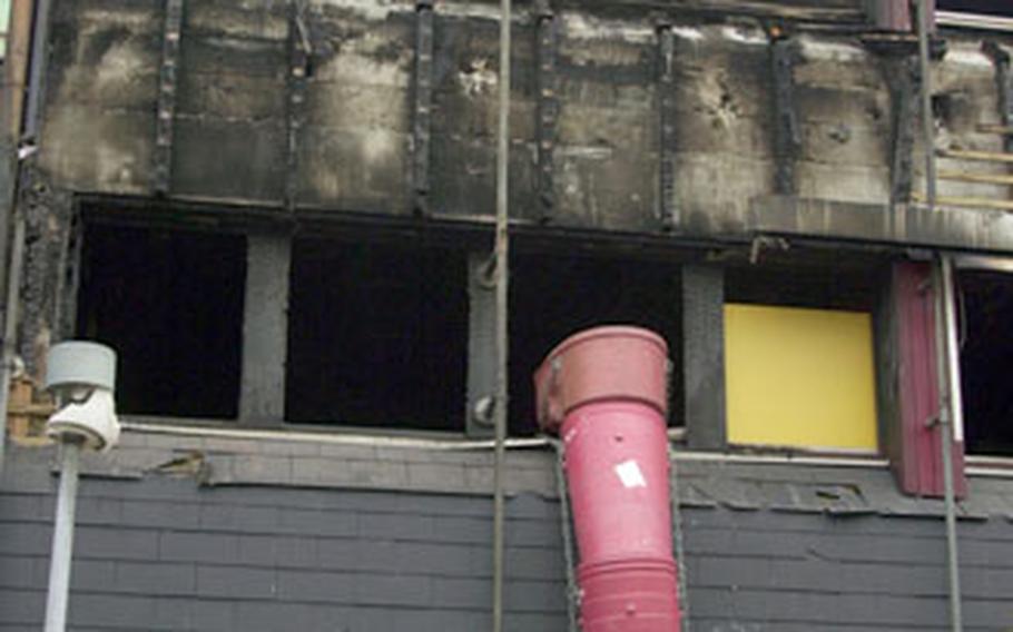 The second story exterior of Baumholder, Germany’s city government building was charred after a fire in August. A military judge sentenced Pfc. Zachary Watson to 15 years in prison for his part in a crime spree that included the fire.