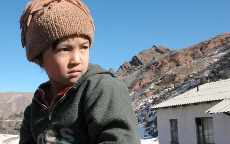 A young Kyrgyz girl sits astride her horse in the snow-capped mountain ranges of Kyrgyzstan. She was at a hut visited by U.S. airmen deployed to Manas Air Base who were riding horses through the area.