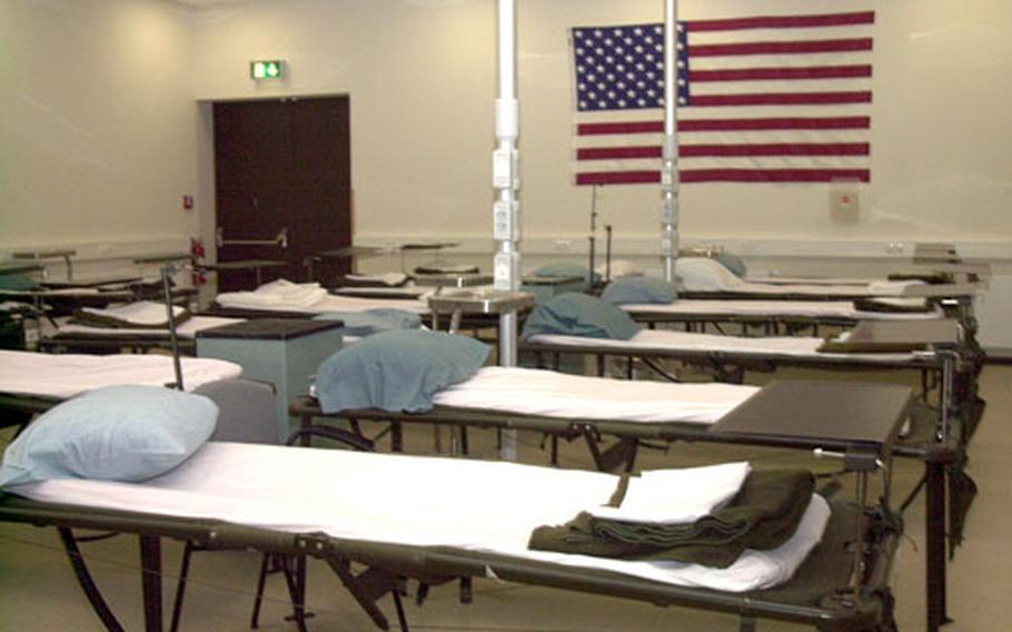 Neatly-made beds, or litters, for wounded patients at the new Contingency Aeromedical Staging Facility at Ramstein Air Base, Germany. The Air Force officially opened the building on Friday.