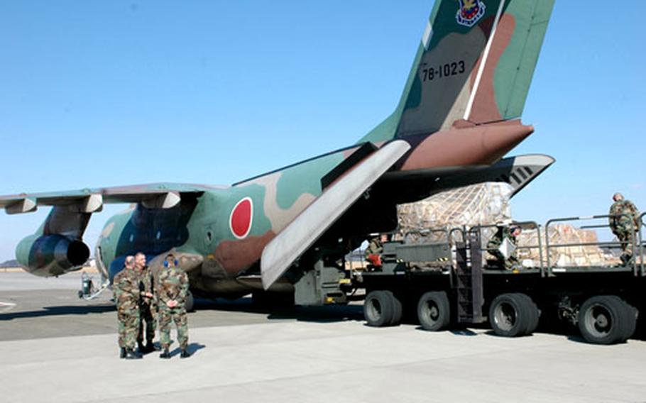 A Japanese C-1 from Iruma Air Base in Saitama prefecture is loaded with cargo Thursday at Yokota Air Base, Japan, during the Japan Air Self-Defense Force’s 300th mission in support of Operation Freedom Lift. The 5th Air Force staged a small ceremony to mark the milestone.