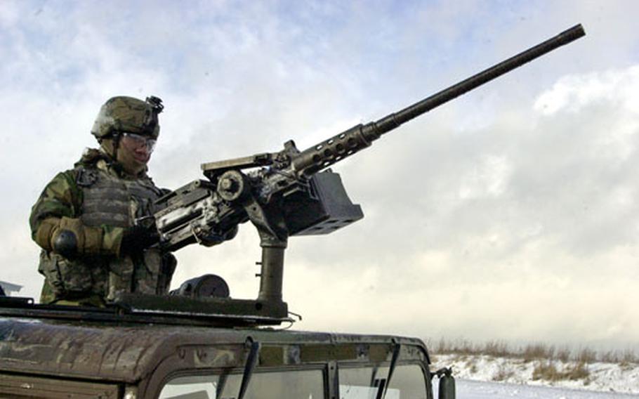 A 1st Battalion, 7th Field Artillery Regiment soldier mans an entry control point at Grafenwöhr Training Area, Germany, on Thursday.