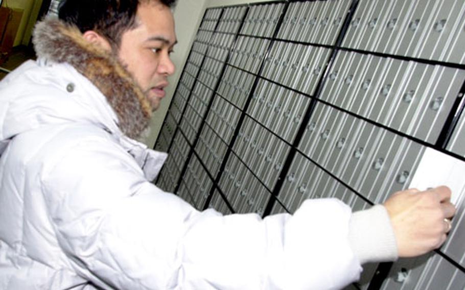 Postal officer Derick Ferrer checks out a new community mail room due to open at Grafenwöhr on Feb. 25.