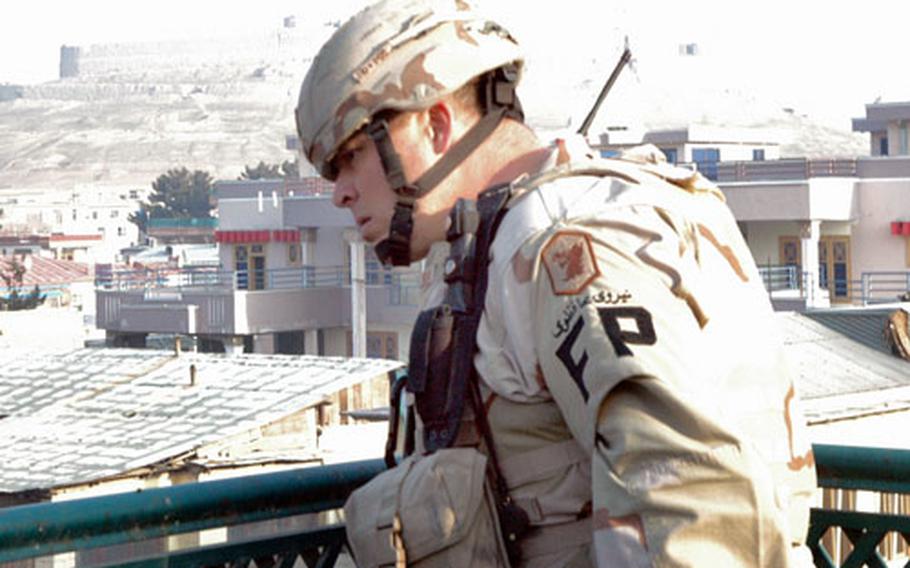 A soldier patrols "safe houses" in Kabul during a recent mission. The security team encountered more than it bargained for during its yearlong deployment.